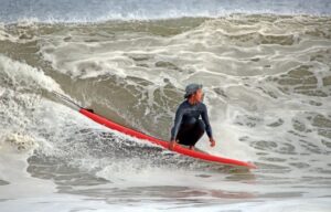 How do you prepare a surfboard for a traction pad