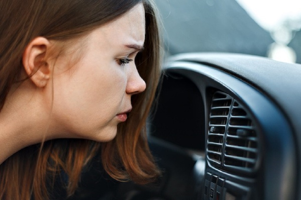 Why does my car smell when going uphill