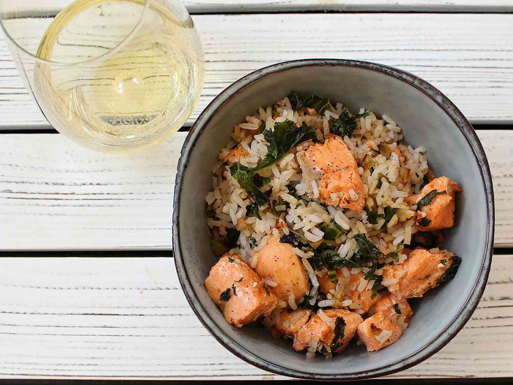 Healthy steamed salmon and quinoa bowl made effortlessly in a mini rice cooker.